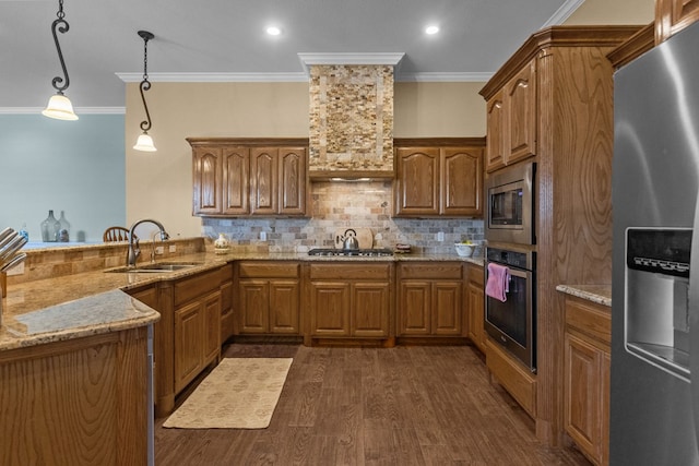 kitchen with light stone countertops, dark wood finished floors, appliances with stainless steel finishes, brown cabinetry, and a sink