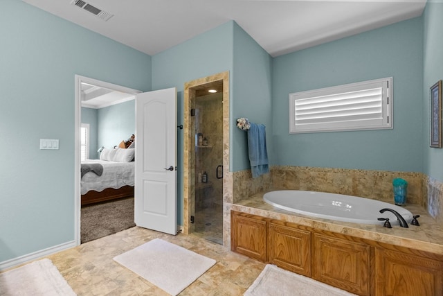 bathroom with a bath, visible vents, ensuite bathroom, and a stall shower