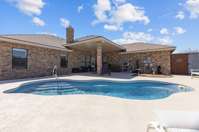 pool with a patio area