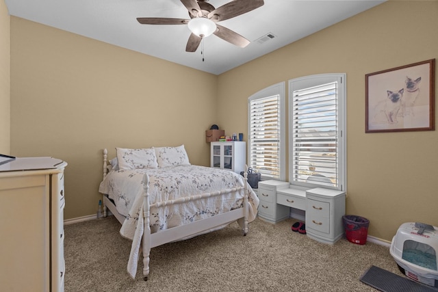 carpeted bedroom featuring ceiling fan and baseboards