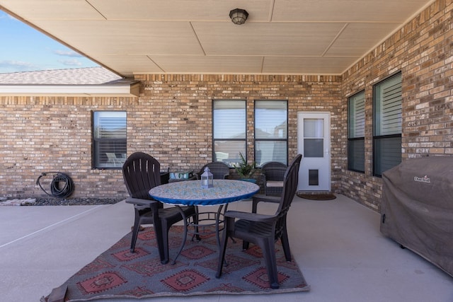 view of patio featuring a grill and outdoor dining space