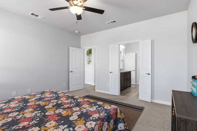 bedroom with light carpet, baseboards, visible vents, and a ceiling fan