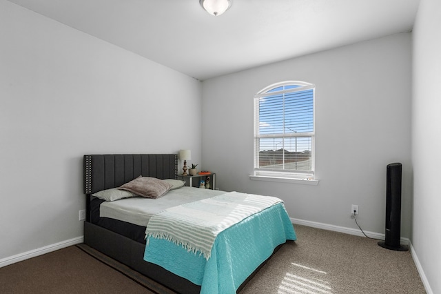 bedroom with carpet flooring and baseboards