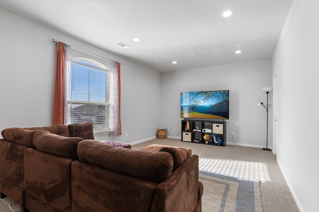 living room with carpet floors, recessed lighting, visible vents, and baseboards