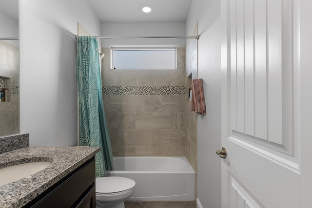 full bath with toilet, shower / bathtub combination with curtain, and vanity