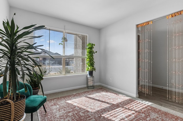 unfurnished room featuring baseboards and wood finished floors