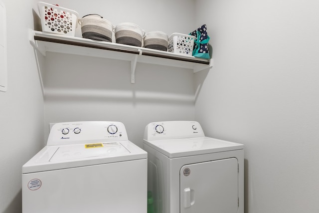 laundry room with laundry area and washer and clothes dryer