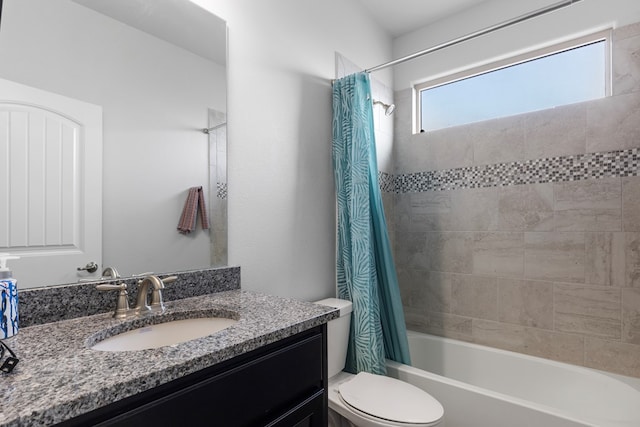 full bathroom featuring shower / tub combo, vanity, and toilet