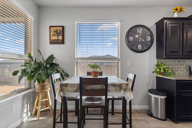 dining space featuring baseboards