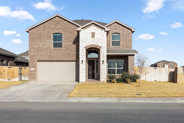 view of front facade featuring brick siding, an attached garage, fence, stone siding, and driveway