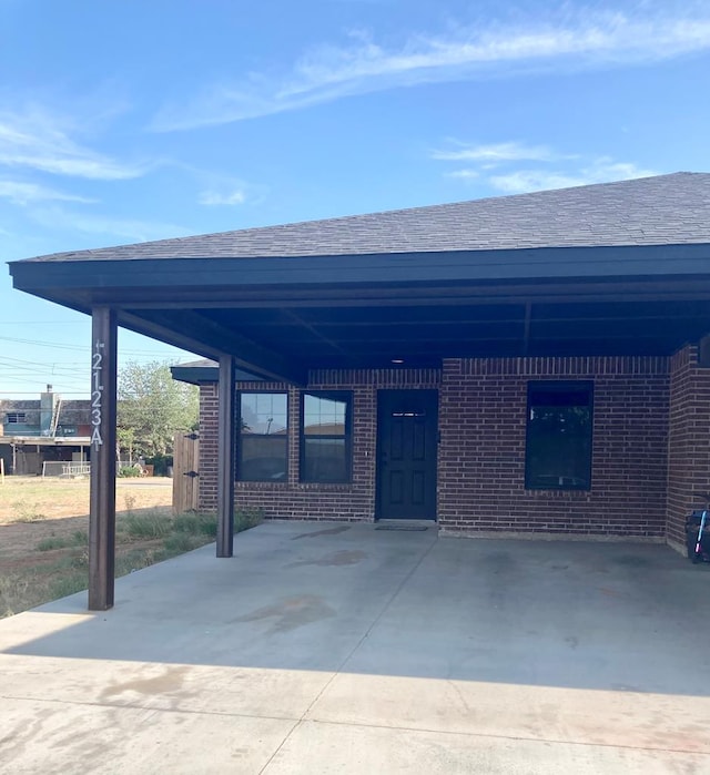 view of patio / terrace with a carport