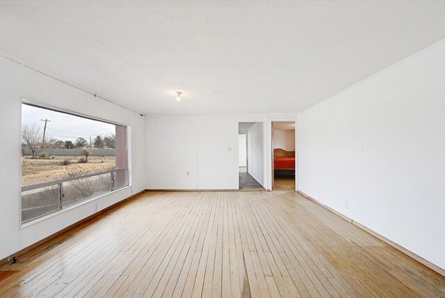 unfurnished room featuring light hardwood / wood-style floors