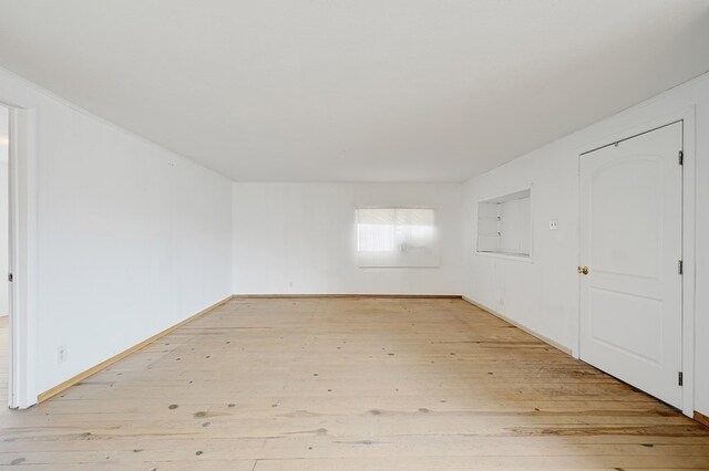 unfurnished room with light hardwood / wood-style floors