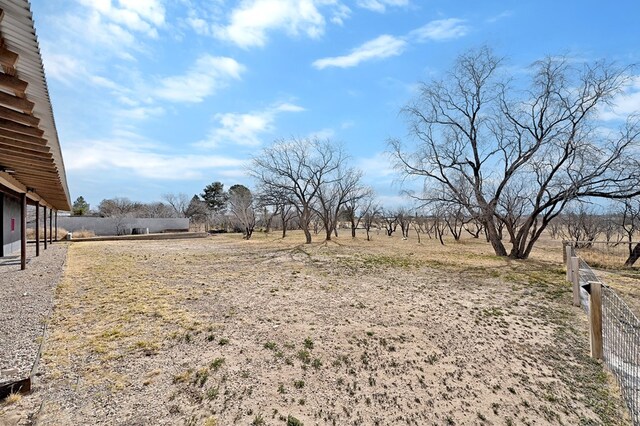 view of yard with a rural view