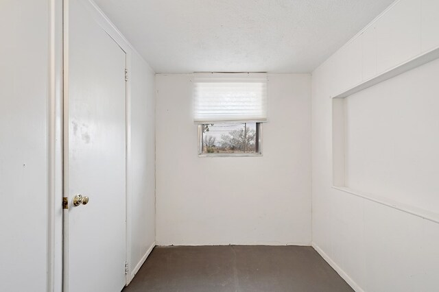 empty room with a textured ceiling