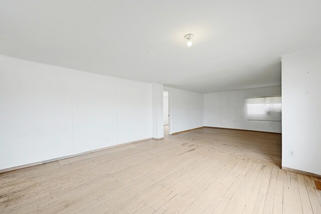 unfurnished room featuring light hardwood / wood-style floors