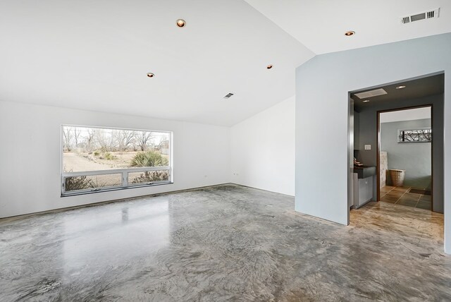 spare room with lofted ceiling