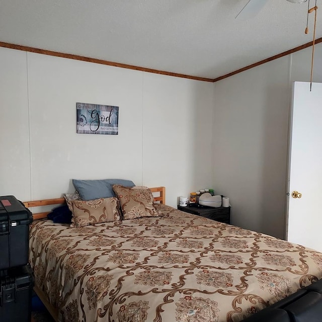 bedroom featuring ceiling fan and crown molding