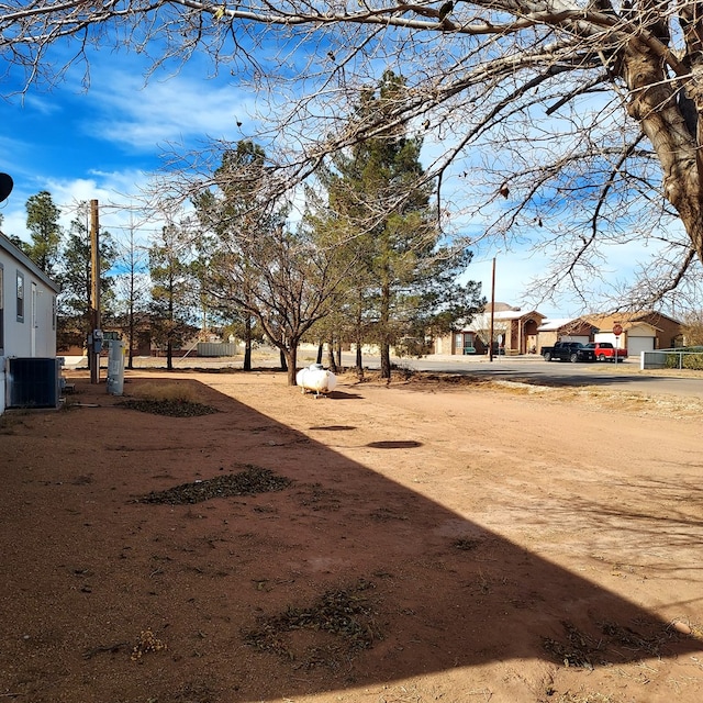 view of yard with central AC unit