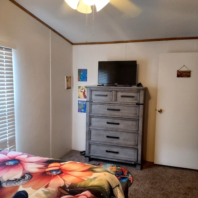 carpeted bedroom featuring ceiling fan and ornamental molding