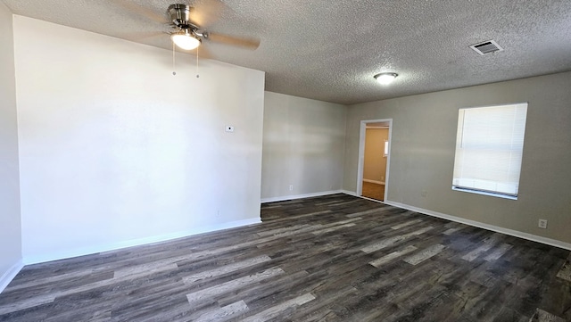 spare room featuring a textured ceiling, dark hardwood / wood-style flooring, and ceiling fan