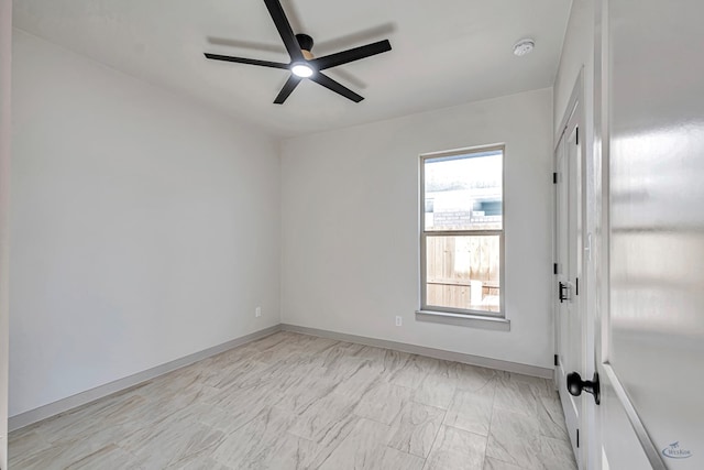 spare room with ceiling fan