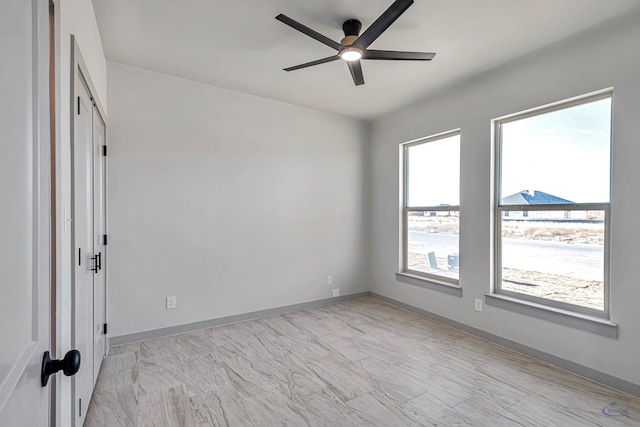 unfurnished room with ceiling fan