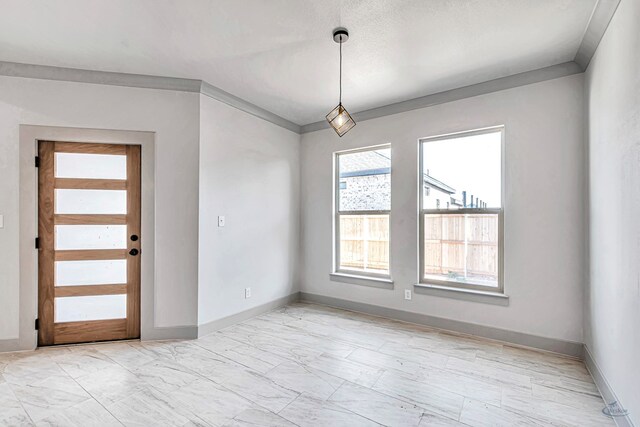 unfurnished room featuring ornamental molding