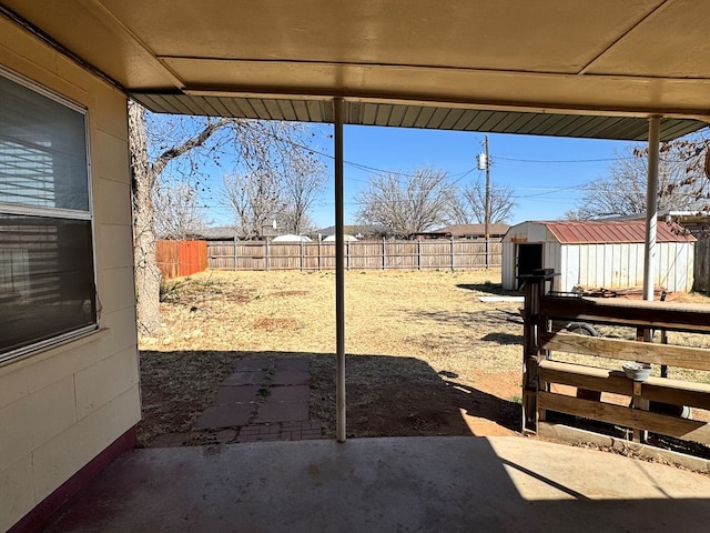 view of yard with a patio area, a shed, a fenced backyard, and an outdoor structure