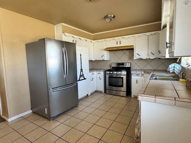 kitchen featuring under cabinet range hood, appliances with stainless steel finishes, backsplash, and light tile patterned flooring