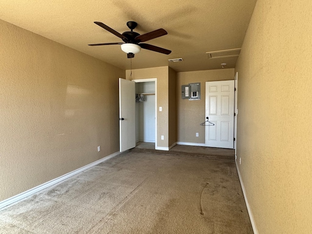 unfurnished bedroom featuring a closet, visible vents, a textured wall, and a textured ceiling