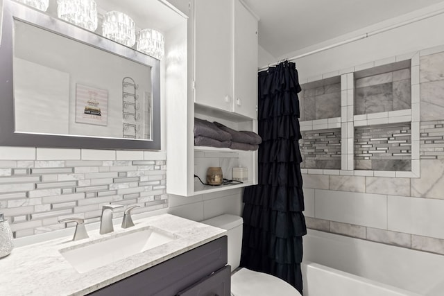 full bath with tasteful backsplash, vanity, toilet, and shower / tub combo