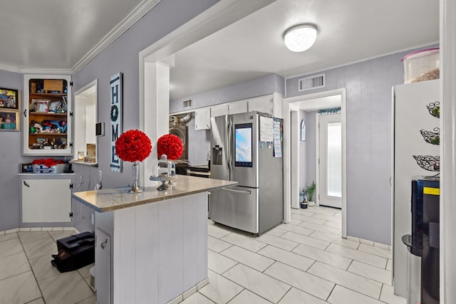 kitchen featuring visible vents, ornamental molding, white cabinets, a peninsula, and stainless steel fridge with ice dispenser