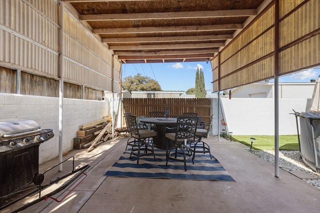 view of patio / terrace featuring outdoor dining area, grilling area, and a fenced backyard