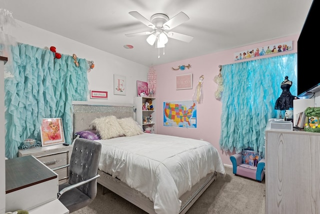 bedroom featuring light carpet and ceiling fan