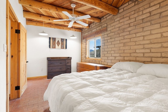 bedroom with beamed ceiling, brick wall, and wooden ceiling