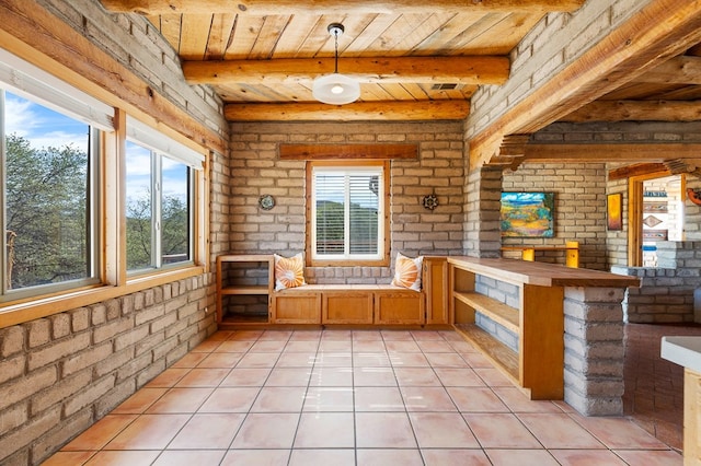 unfurnished sunroom with wooden ceiling and beam ceiling