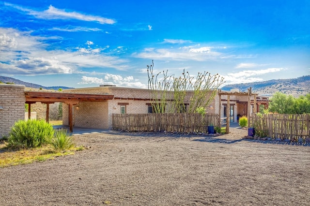 view of front of home featuring a mountain view