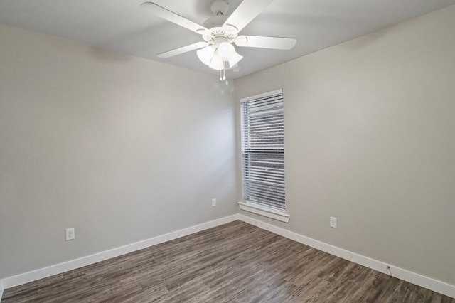 unfurnished room featuring ceiling fan, baseboards, and dark wood-style floors