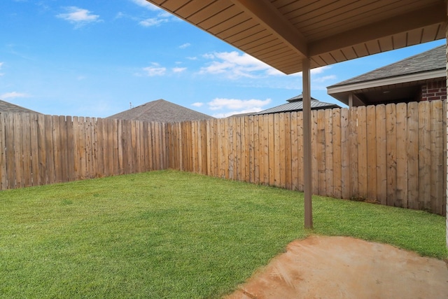 view of yard with a patio area and a fenced backyard