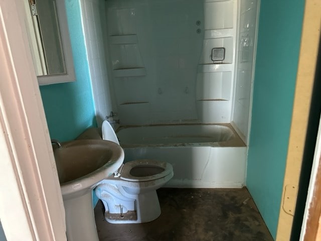 bathroom with shower / bathing tub combination and toilet