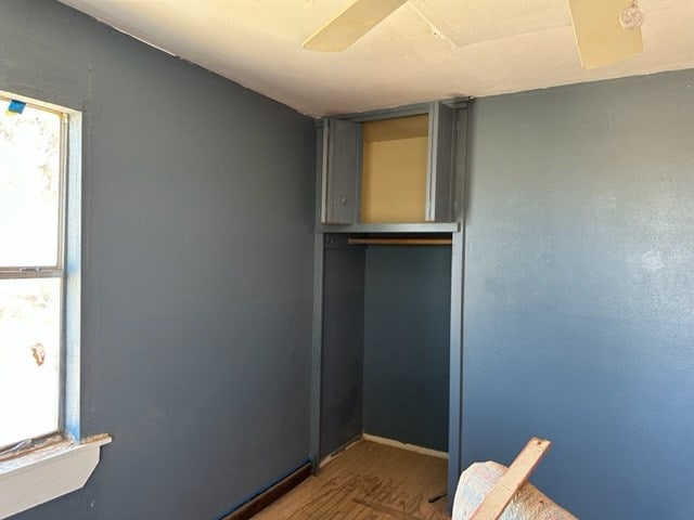 interior space with ceiling fan and hardwood / wood-style floors