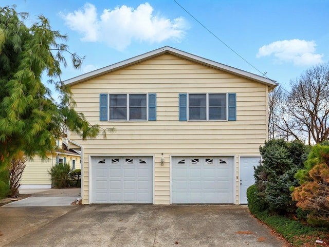 702/704 S Wilbur Ave, Sayre, PA 18840 - view of side of property featuring an attached garage and concrete driveway