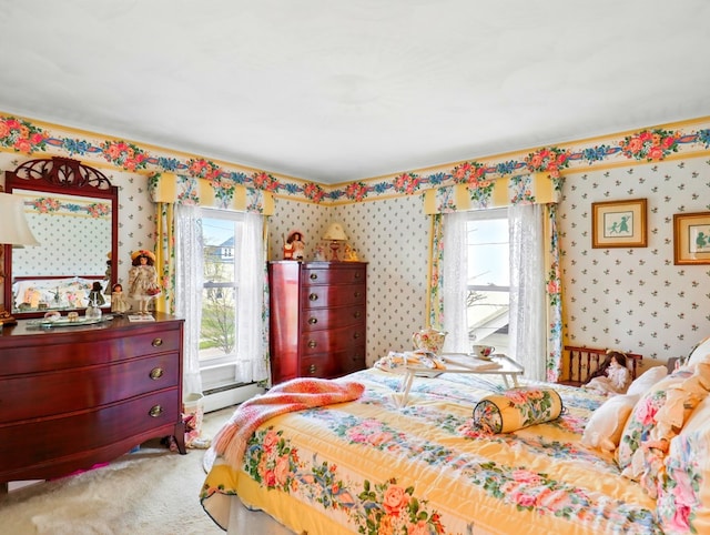702/704 S Wilbur Ave, Sayre, PA 18840 - bedroom with multiple windows, wallpapered walls, carpet flooring, and a baseboard radiator