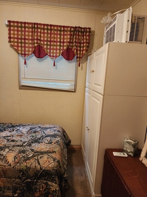 bedroom featuring carpet and multiple windows