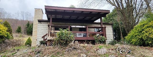 rear view of property with a chimney