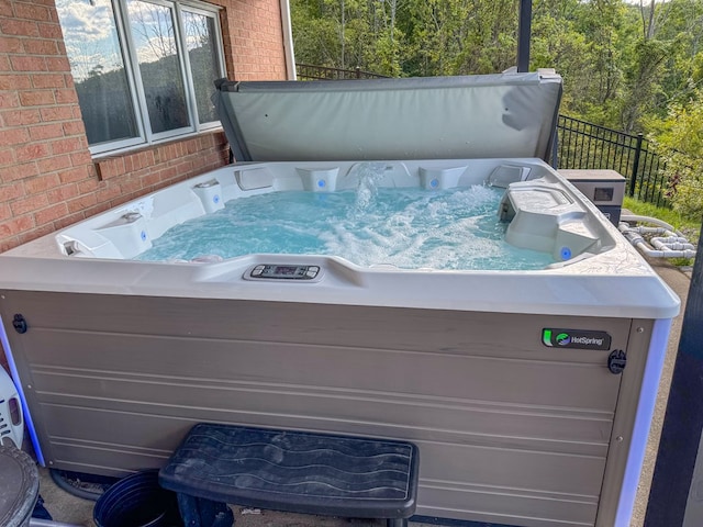 view of patio / terrace with a hot tub