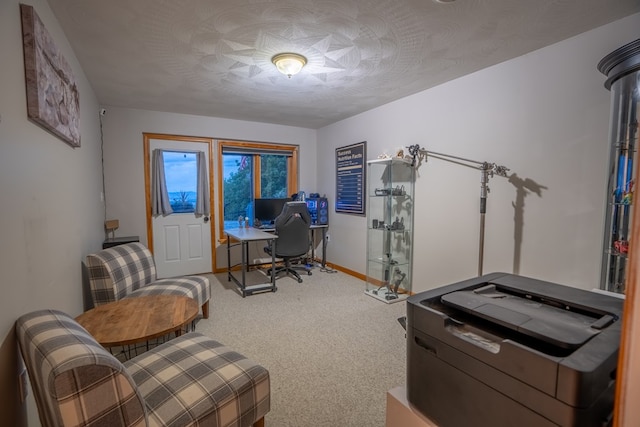 office with carpet and a textured ceiling