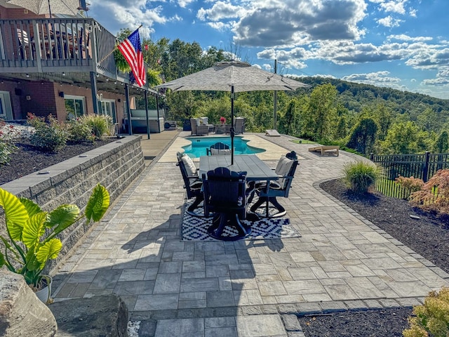 view of patio featuring a fenced in pool and an outdoor hangout area