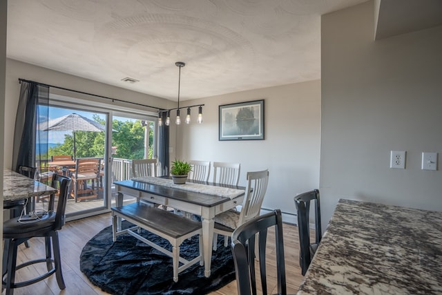 dining space featuring hardwood / wood-style flooring